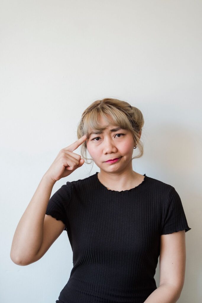 woman thinking and forgetting what to say
